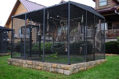 a house with a large cage in front of it