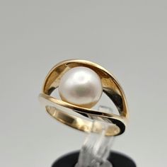 Vintage 14k Yellow Gold Pearl Ring Item w#275 This vintage 14k yellow gold ring showcases a beautiful 7.9mm genuine pearl at its center, offering a classic and timeless design. The warm yellow gold complements the lustrous pearl, creating a piece that's perfect for both everyday elegance and special occasions. Clean and in good condition, this ring is marked 14k and weighs 6 grams. A wonderful example of estate jewelry, it's ideal for collectors or as a thoughtful gift for her. Material: 14k Yel Vintage Native American Jewelry, June Birthstone Ring, Gold Pearl Ring, Vintage Designer Jewelry, Thoughtful Gifts For Her, Everyday Elegance, Warm Yellow, June Birthstone, June Birth Stone