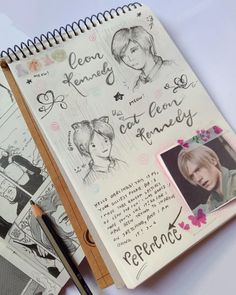 an open notebook with some drawings on it