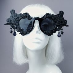 Hand-decorated black filigree ornate sunglasses. Decorated with hand moulded filigree, crosses & angel wings. They are UV400. With detailing on the arms. Dripping with black jewels. You can get these sunglasses in different coloured filigree! Currently my list is: Black White Red Silver (£5 extra) Gold (£5 extra) Yellow Orange Green Pink Pastel Pink Blue Pastel Blue HOWEVER most of my sunglasses base is red, white or black at this time. Just message me at the checkout to ask if i can change Black Glass Sunglasses For Festival, Black Sunglasses With Gradient Lenses For Festival, Black Tinted Sunglasses For Festival, Gothic Black Sunglasses For Party, Black Gothic Sunglasses For Party, Vintage Black Sunglasses For Festival, Sunglasses Decorated, Dark Beauty Magazine, Black Mass