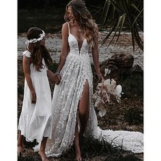 two girls in white dresses holding hands and walking together with the caption mother daughter love