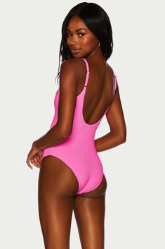 With a classic and flattering fit the Reese one piece features a plunge neckline, low dipped back, adjustable straps and moderate bottom coverage. Featured in our best-selling ribbed fabric in a bright neon pink shade. This swimsuit has a shelf bra and removable cups. Pink One Piece Swimsuit, Pink One Piece, Crochet Shop, Beach Riot, Pink Shade, Beach Swimsuit, Plunge Neckline, Mother Denim, One Piece Swim