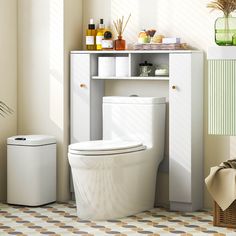 a white toilet sitting in a bathroom next to a shelf with bottles on top of it