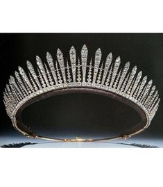 a tiara is shown on display in this image, it has many small diamonds