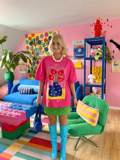 a woman standing in a brightly colored room