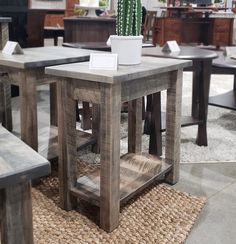 a wooden table sitting on top of a rug