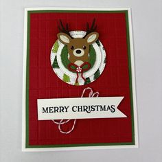 a christmas card with a deer on it