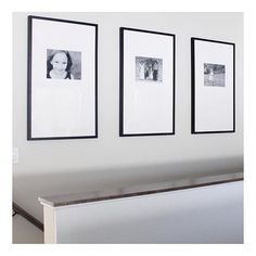 three black and white pictures hanging on the wall