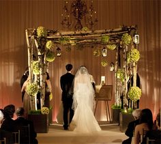 the bride and groom are walking down the aisle