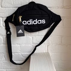 Nwt Adidas Black Belt Bag New With Tags Adidas Black And White Belt Bag Gold Zippers Adjustable Strap Top Zip Closure Exterior Front Zip Pocket Inside Lined 100 % Recycled Polyester Sporty Black Crossbody Shoulder Bag, Black Logo Bag For On-the-go, Casual Logo Bags For On-the-go, Black On-the-go Bag With Logo, Black On-the-go Bags With Logo, Black Bags With Zipper Closure For Streetwear, Sporty Crossbody Bag For Streetwear, Black Streetwear Bag With Zipper Closure, Sporty Adidas Bag With Zipper Closure