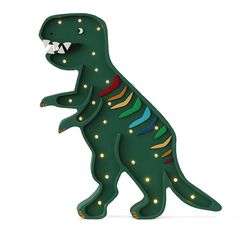 a toy dinosaur with its mouth open and lights on it's back, in the shape of a t - shirt