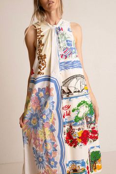 a woman in a dress with pictures on it