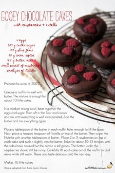 chocolate cakes with raspberries are on a cooling rack