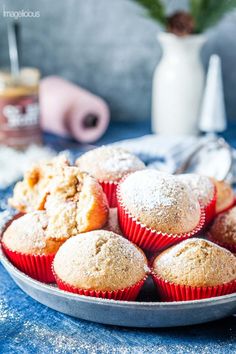 muffins on a plate with powdered sugar