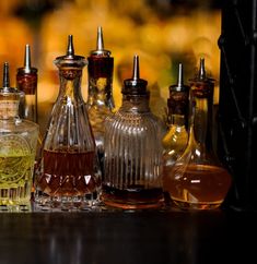 an assortment of liquor bottles lined up on a table