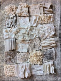 many different pieces of cloth are arranged on a piece of burlly fabric that has been stitched together