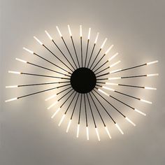 a circular light fixture with many lights on it