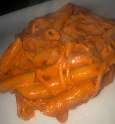 some type of pasta on a white plate