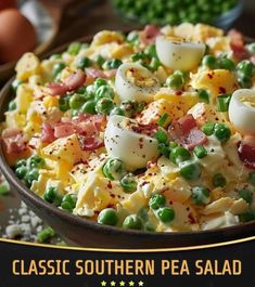 a bowl filled with eggs, peas and ham on top of a table next to other food