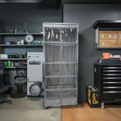 a room filled with lots of tools and storage containers on top of wooden flooring