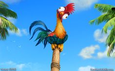 a colorful rooster perched on top of a palm tree in front of a blue sky