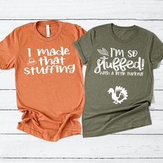 two t - shirts that say i made that stuffing and i'm so stuffed with a little turkey