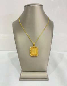 A Himo square pendant in 21k gold would be a stylish and contemporary choice. Himo is a versatile design element that can be interpreted in various ways, and when crafted in 21k gold, it adds a touch of luxury and elegance to the piece. This pendant would be suitable for both casual and formal occasions, making it a versatile addition to your jewelry collection. 13.79 grams with 18” chain Luxury Single Diamond Square Pendant Jewelry, Luxury Diamond Necklace With Square Pendant As Gift, Luxury Gold-plated Pendant Temple Necklace, Gold Pendant Jewelry Indian, Necklace Gold Indian, Square Necklace, Gold Pendant Jewelry, Gold Locket, Square Pendant