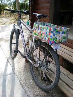 a bicycle parked on the side of a wooden building