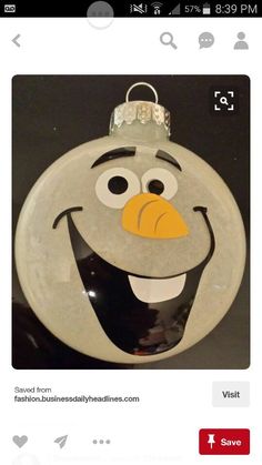 a glass ornament with an image of a cartoon character on it's face