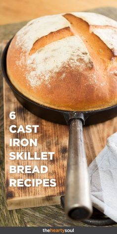 a loaf of bread sitting on top of a wooden cutting board next to a knife