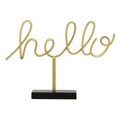 the word hello is written in gold on a black stand