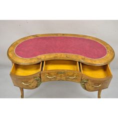 an antique desk with two drawers and a pink top