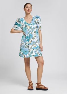 A-line short-sleeve dress designed with a v-cut neckline decorated with pintuck pleats, a half-buttoned front, and rounded puff sleeves. The skirt is cut in a loose-fit silhouette with tiered stitch detailing.Length of dress: 86cm / 33.9" (EU 36 / UK 8 / US 4) Waistcoat Dress, A Line Shorts, Dress Crafts, Spring Wardrobe, V Cut, Cotton Voile, Knitwear Cardigan, Fashion Story, Dress Trousers