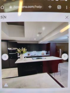 an image of a kitchen being viewed through a cell phone screen with the camera attached to it