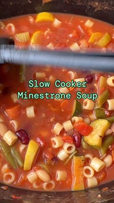 slow cooker minestone soup with noodles and vegetables in the crock pot, ready to be eaten