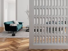 a living room with a blue couch and wooden flooring next to a white wall