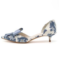 Elegant and chic, these White Satin Kitten Heel Pumps feature a charming Blue Floral design and delicate Bow detailing, perfect for special evenings and events. Sophistication meets style effortlessly. Color: White and blue Material: Satin Heel Type: Kitten heel Heel height: 1.5" / 38 mm approx Product measurements were taken using size 8. Please note that measurements may vary by size. Toe: Pointed toe Blue satin bow embellishment Blue floral pattern upper Handcrafted US sizing. Fits true to si White Kitten Heels, Heels Blue, Timeless Shoes, Special Occasion Shoes, Bow Pumps, White Kittens, Blue Pumps, Satin Heels, Kitten Heel Pumps