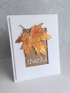 a card with a leaf on it that says thanks