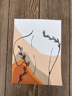 an abstract painting with leaves and mountains in the background on a piece of white paper