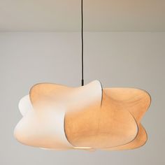 a light hanging from a ceiling in a room