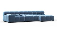 a blue couch sitting on top of a white floor