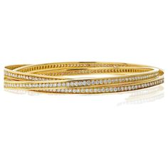 Cartier 18K Yellow Gold Trinity Diamond Slip-On Bracelet. This iconic piece seamlessly combines Cartier's renowned Trinity design with the brilliance of round-cut diamonds totaling 6.50 carats. Each diamond is meticulously set to enhance its natural sparkle, creating a breathtaking display of light and luxury. Crafted in radiant 18K yellow gold, this slip-on bracelet offers both sophistication and ease of wear, fitting comfortably on wrists up to 7.5 inches. The harmonious blend of gold and diamonds makes it a versatile accessory, perfect for adding a touch of glamour to any occasion, from everyday elegance to special events. Grams: 60gr. Vintage Cartier Watch, Modern Bangle, French Modern, Modern Bracelets, Everyday Elegance, Enamel Bracelet, Diamond Star, Yellow Gold Bracelet, Cartier Love Bracelet