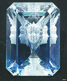 a blue diamond with an angel face on it