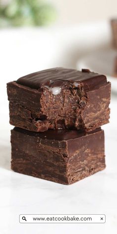 two pieces of chocolate brownie stacked on top of each other