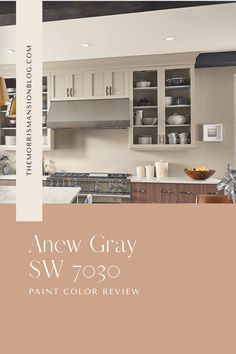 the new gray sw 709 paint color is shown in this kitchen with white cabinets