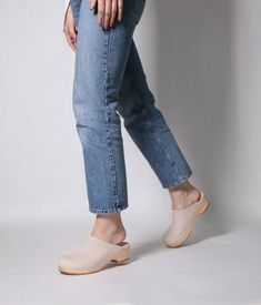 Elevate your everyday style with our minimalist clog mule, featuring clean lines and a timeless aesthetic that effortlessly transitions from day to night. Clog measurements:Heel height: 1 3/4” (4.5 cm)Toe height: 1 5/8″ (4.1 cm) Fit:RegularLeather:Nubuck leather Clogs consist of:Base: European Lime Wood Sole: Rubber sole Fastening: Staples Cork Sandals, Wooden Clogs, Timeless Aesthetic, Clog Sandals, Leather Clogs, Day To Night, To Night, Nubuck Leather, Boot Shop