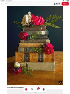 three books stacked on top of each other with flowers