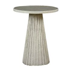 a white table with a circular base on the top and an intricate column at the bottom