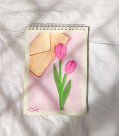 a drawing of pink tulips and an envelope