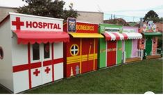 a row of brightly painted buildings with awnings